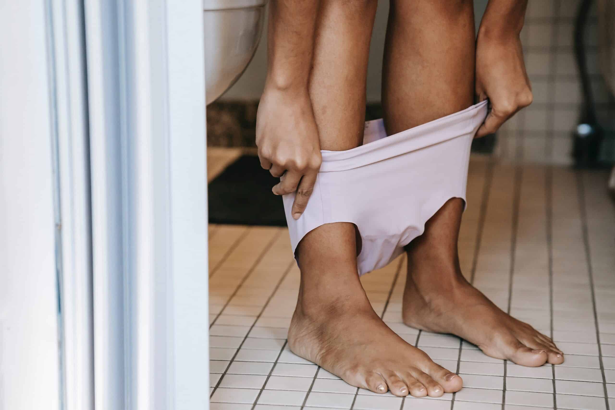 woman using toilet with vaginal condition