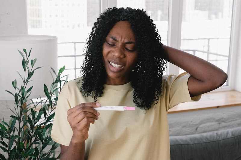 woman with pregnancy test