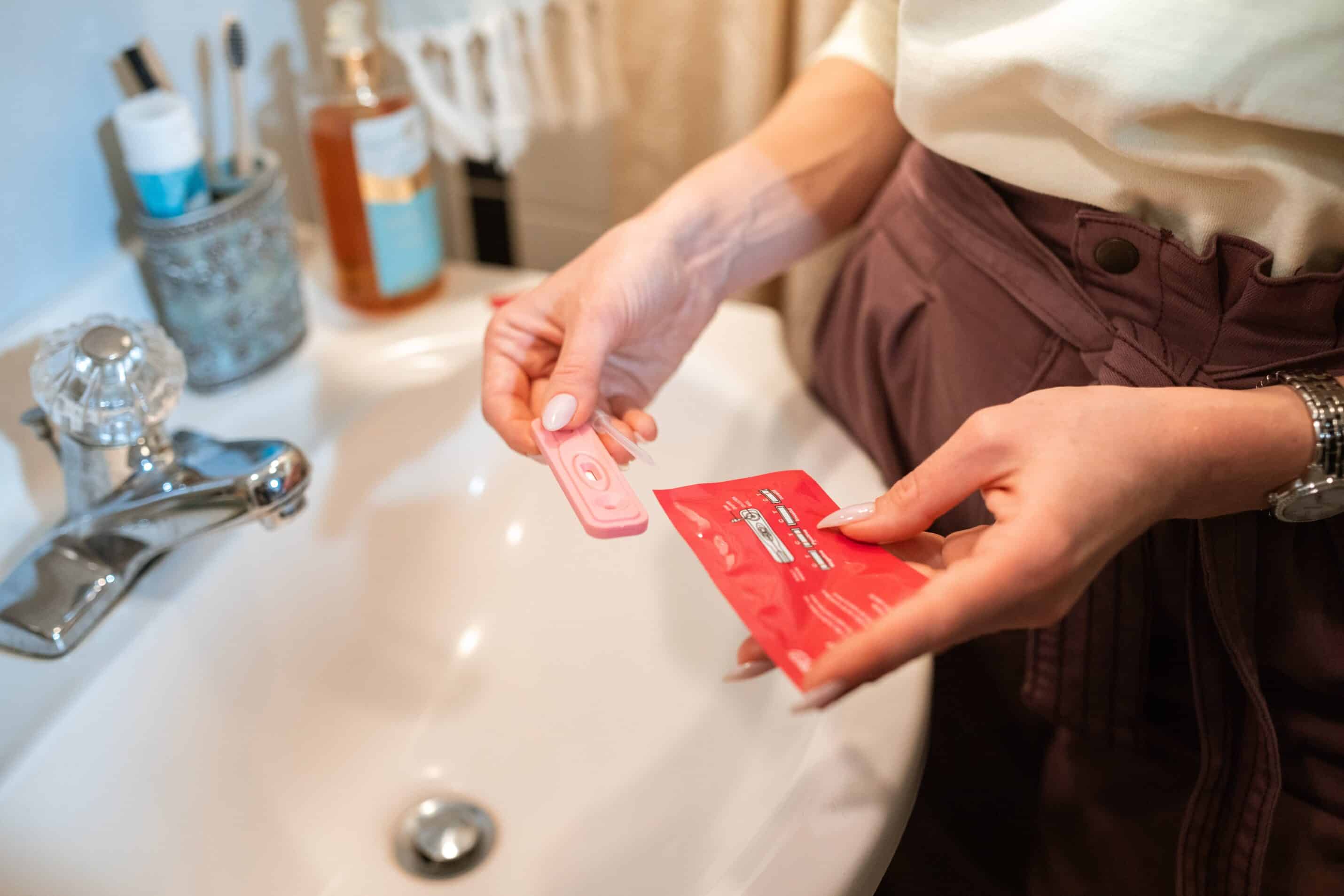 Woman checking a pregnancy test