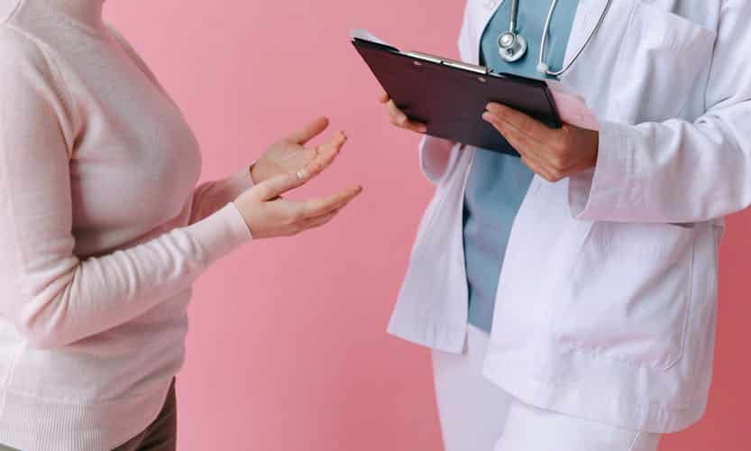 Doctor talking with woman