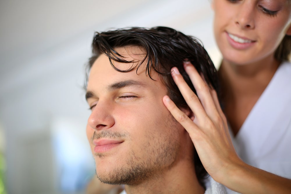 man having head massage