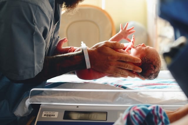 baby being weighed